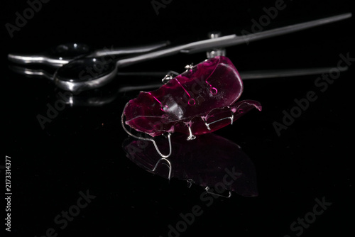 Quadro su tela Dentistry tools and models on a black background.