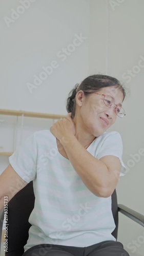 Asian senior woman use hand squeeze nape to relieves symptoms cramps, pain muscle, osteoporosis. Elderly female patient massages shoulder, arm for lifestyle healthcare, arthritis aches. Wellness 