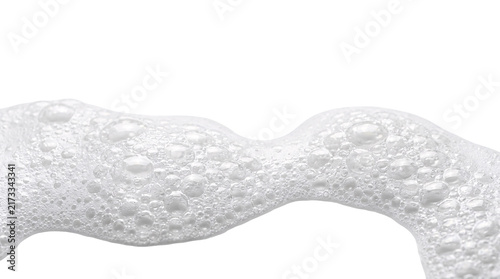 Wavy white soap foam texture with bubbles for background.