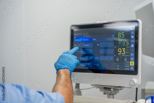 Medical professional operating patient monitoring system in hospital