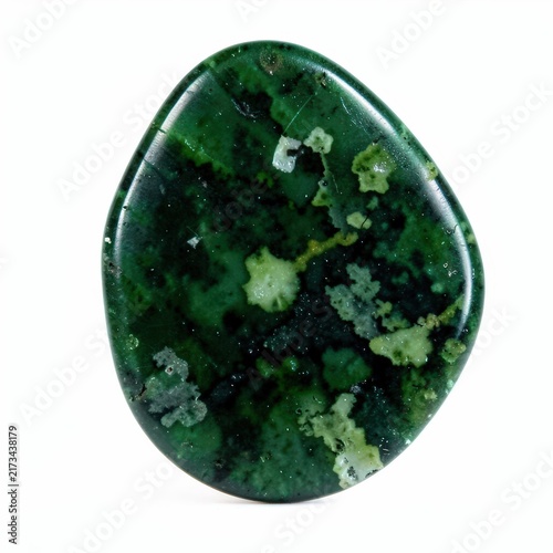 Deep green unpolished jadeite stone with mottled lighter patterns on white background for gemstone and mineral collections