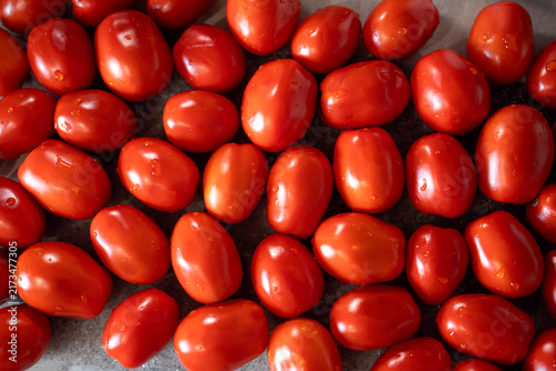 Fresh red tomatoes as background