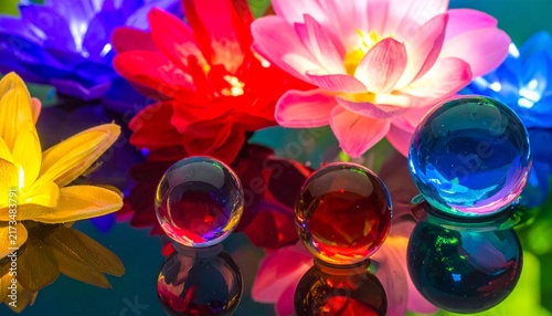 Colorful Glass Spheres Floating Around Luminous Flowers, Symbolic Diversity and Enchanting Reflections
