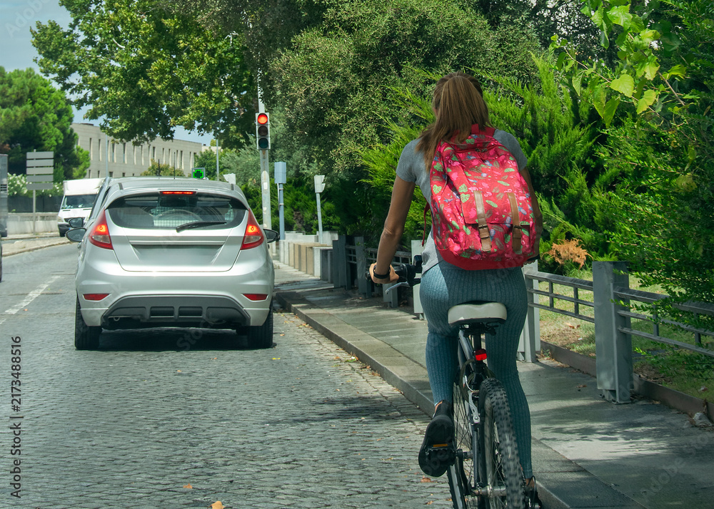 Naklejka premium Cyclist traveling through Evora streets