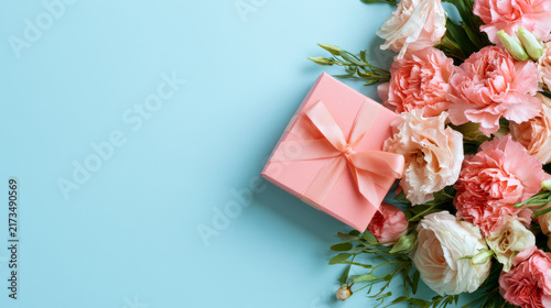 Elegant Floral Gift Box Flat Lay on Pastel Blue Background for Celebration and Greeting Design
