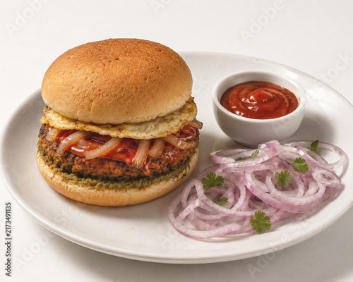 Spicy Egg Burger with Grilled Onions, Sauce and Onion Salad