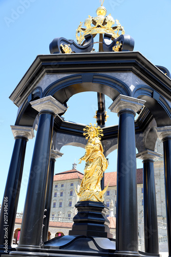 Картината върху платно Golden Virgin Mary statue at Marienbrunnen in Einsiedeln, Switzerland
