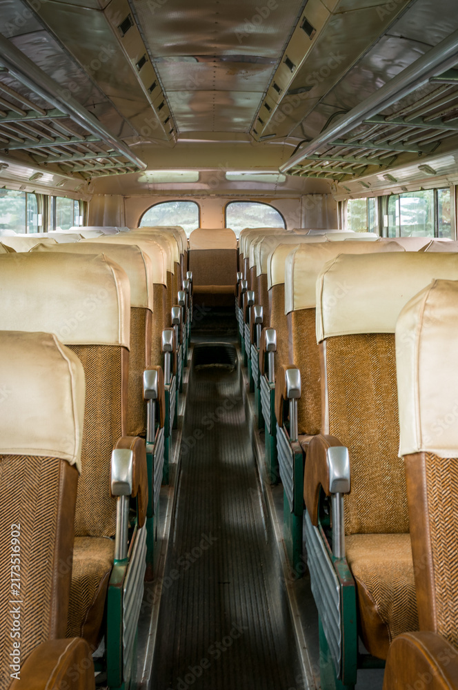 Fototapeta premium Brown Seats on Either Side of Bus Aisle