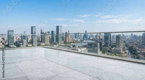 Modern skyscraper city view from high-rise rooftop balcony