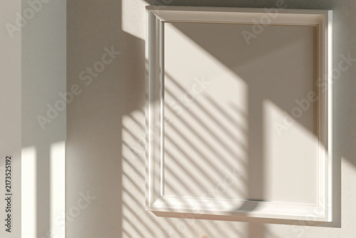 Close up of blank white poster frame mockup on light beige