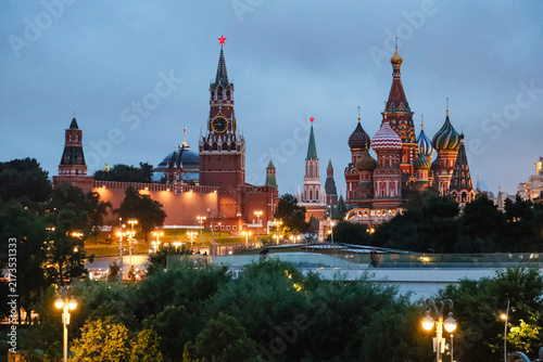 Photography Evening view of Kremlin towers and colorful onion domes of cathedral under cloud