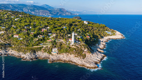 Фотография Aerial drone view of the historic Phare du Cap Ferrat lighthouse, rocky coastlin