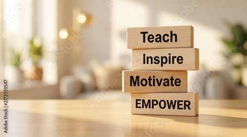 Stack of wooden blocks with the words Teach Inspire Motivate Empower printed on them.