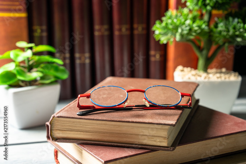 фотографія The book on which the glasses are lying