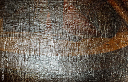 Close-up of an ancient painting surface showing cracked, aged paint and fine lines, revealing vintage texture and artistic decay.