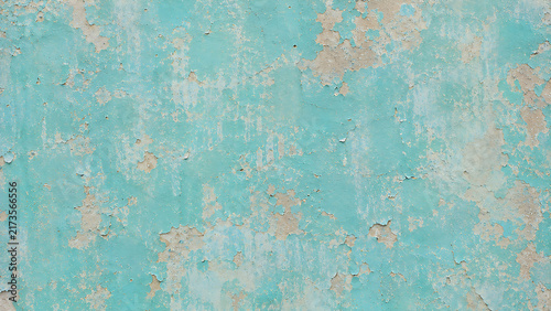 Vintage turquoise peeling paint texture, weathered blue concrete wall background, distressed rustic plaster surface for design
