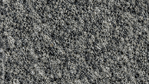 Polished grey granite texture, natural stone surface with black and white speckles, durable granite slab background for architectural design
