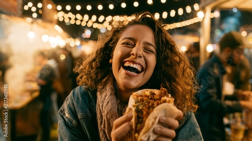 Young woman enjoying a delicious hot dog in a casual restaurant
