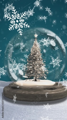 Animation of snow falling over snow globe with christmas tree in winter scenery