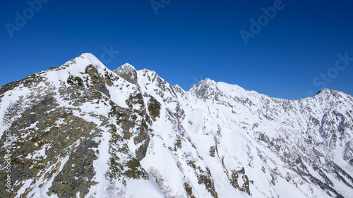 Obraz w ramie 冬の西穂高岳独標山頂から望む西穂高岳へ続く稜線