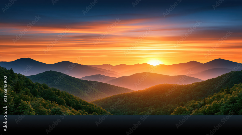 Obraz premium Sunset mountain landscape with layered ridge and glowing sky