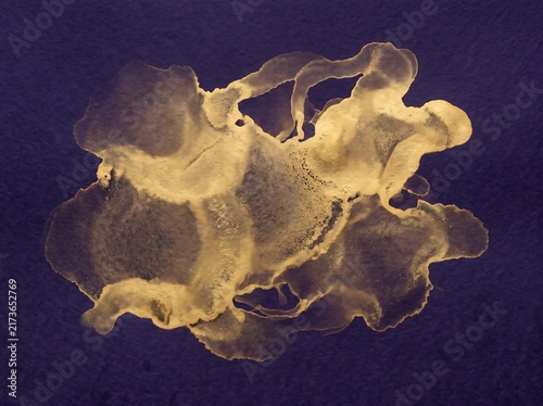 Gold alcohol ink splash on deep purple paper background