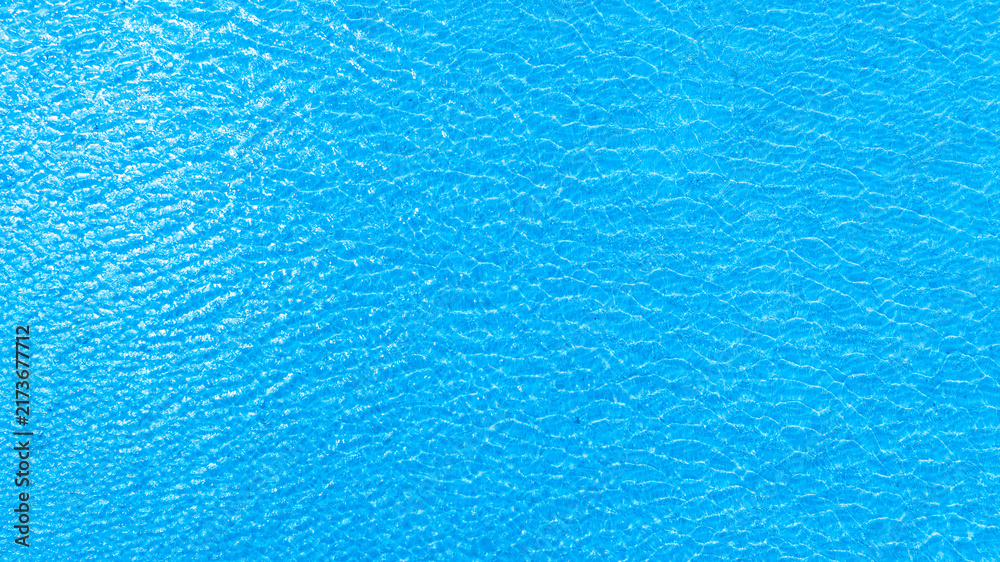 Obraz premium Top view of deep blue sea water surface with small ripples, aerial drone shot of turquoise ocean texture at island , abstract nature background 