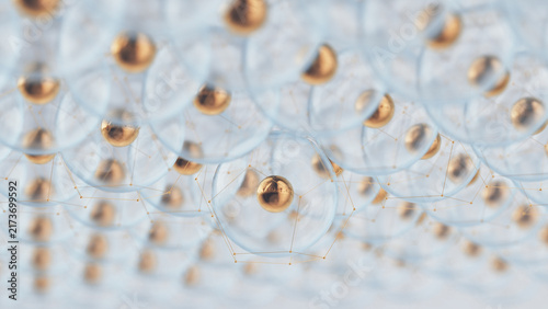 Focused golden sphere within glass membrane surrounded by soft bokeh nanoparticle field