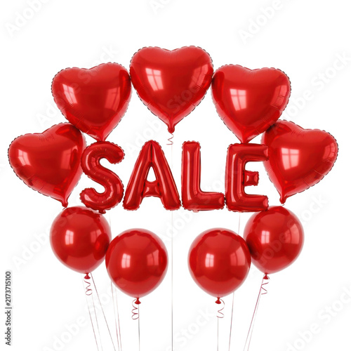 Red heart-shaped and round balloons arranged in a festive display with the word SALE in bold, shiny letters against a clean white background