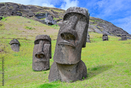Obraz na płótnie Multiple ancient Moai statues partially buried at Rano Raraku quarry on Easter I
