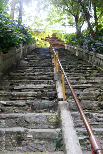 Steep Natural Stone Staircase Approach at the Sixty-Fifth Temple Sankaku-ji on the Shikoku Henro Pilgrimage in Shikokuchuo, Ehime Prefecture, July 2026