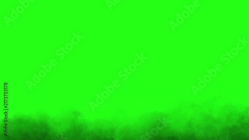 Dark black ground smoke rolling on green screen chroma key