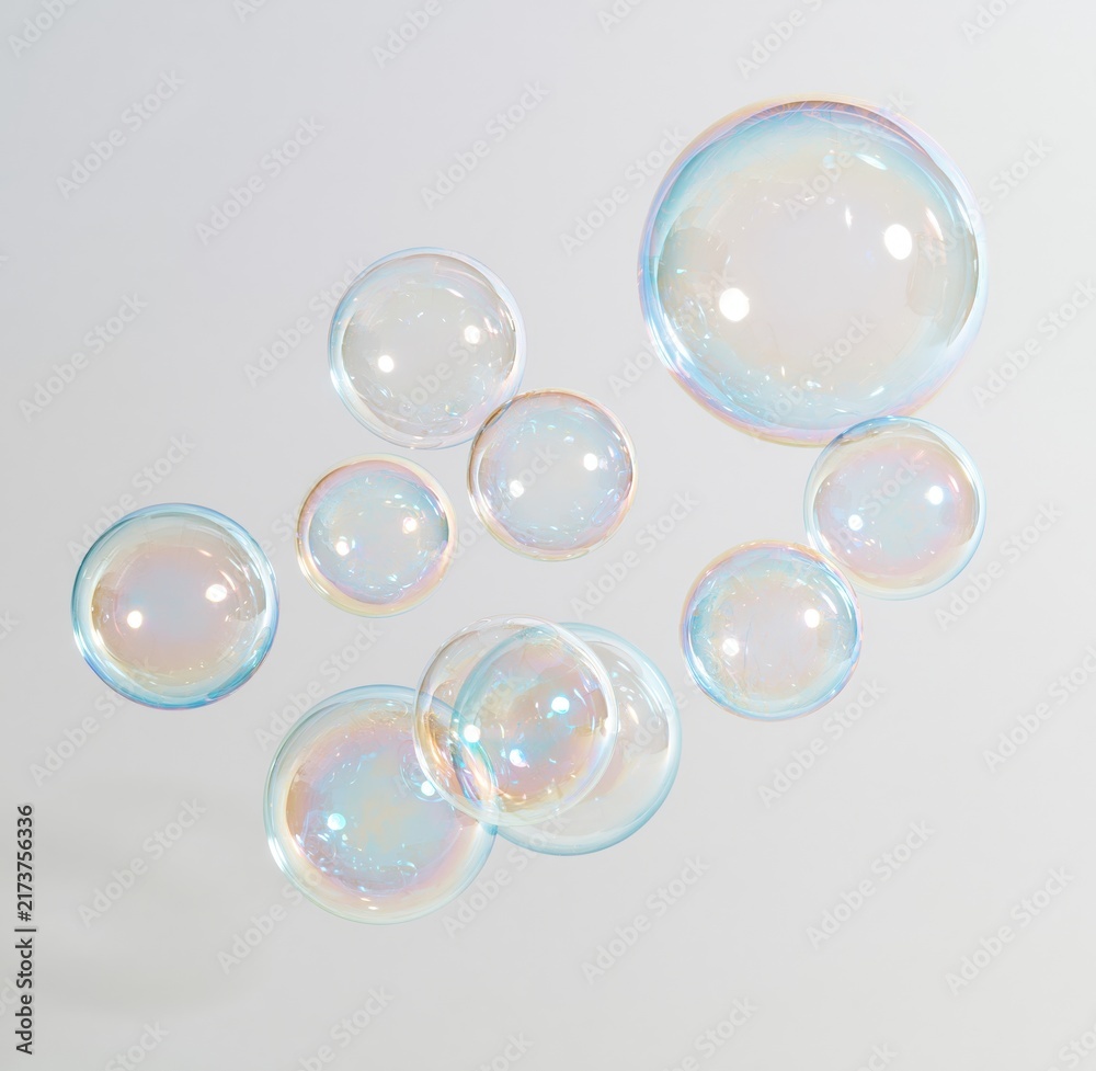 Obraz premium Colorful soap bubbles floating against white background