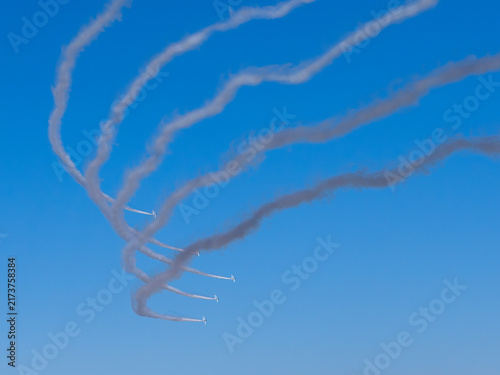 Foto Blue Impulse Smoke Trail Spiral Against Blue Sky