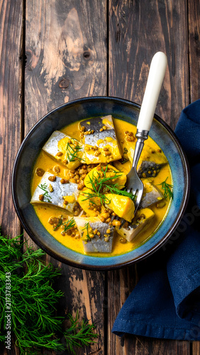 Fish Fillets in Creamy Curry Sauce with Fresh Herbs