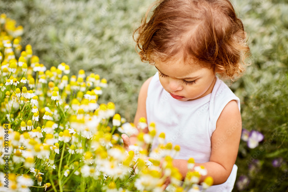 Fototapeta premium Flowers, explore and peace with toddler in garden for spring season, vacation and growth in meadow. Child development, bush and adventure with girl outdoor for nature, calm and countryside plant