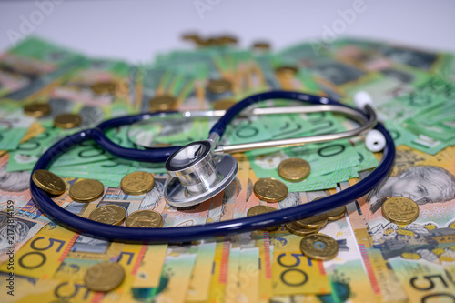 Stethoscope on Australian banknote in concept of Australia economy care, Health insurance and medical cost.