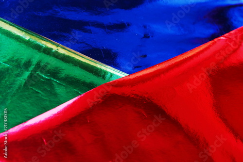 Colorful Metallic Foil Paper Texture Full Frame Background in Red, Blue and Green