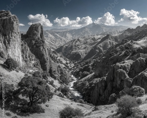 Dramatic Mountain Landscape with River and Clouds in Black and White.