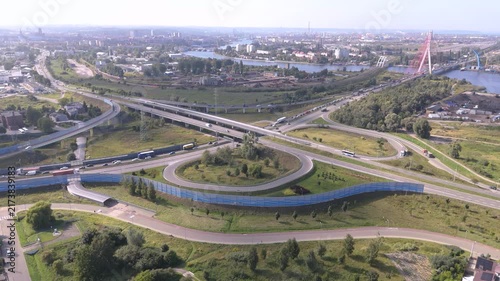 Aerial drone view of highway traffic congestion and heavy freight trucks for road transport and logistics