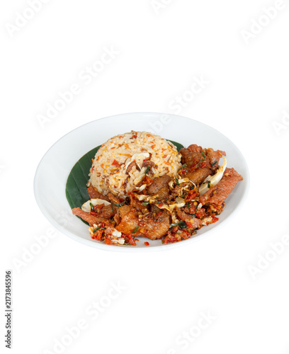 Spicy fried rice served with stir-fried pork, garlic and chili on a white plate isolated on white background