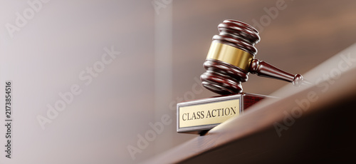 Class Action: Judge's Gavel as a symbol of legal system and wooden stand with text word