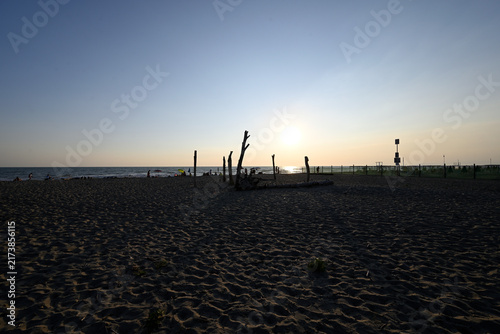 People enjoying sundown at tuscany beach. Togetherness at italian beach. Marina di Torre del LAgo, Tuscany, Italy, Europe.