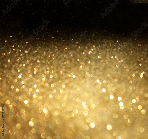 Foto Close up view of golden glitter texture with soft focus and deep bokeh light sph