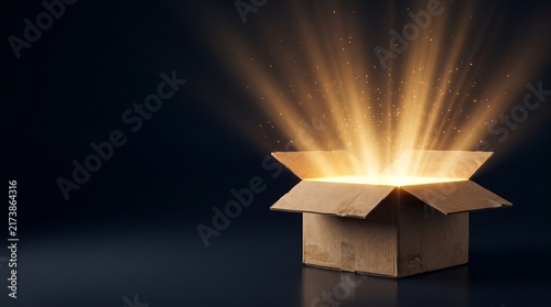 Innovation opportunity concept with glowing light emerging from open box representing new ideas, solutions and creative discovery