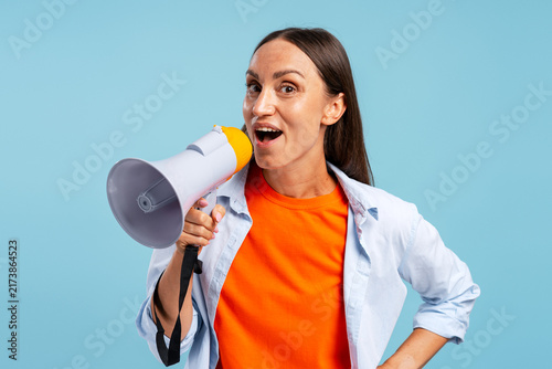 Obraz na plátne Woman making announcement holding megaphone speaking aloud