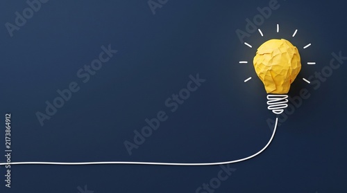 Creative idea background with glowing light bulb edge and dark copy space representing inspiration, innovation and new thinking