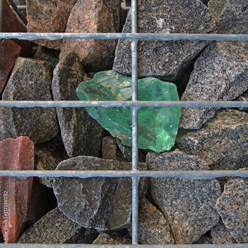 Gabion Wall with Ornate Translucent Stones and Granite Rocks in Wire Mesh Cage
