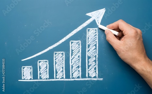 Hand drawing upward trending bar graph with arrow on a blue background