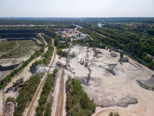 Принти на полотні Wide drone shot captures industrial stone crushing facility emitting dust clouds